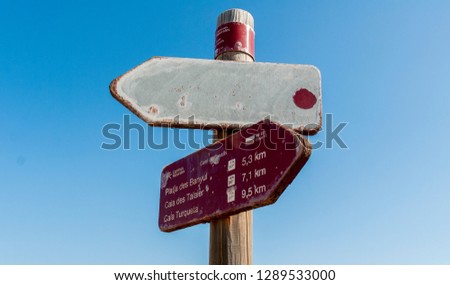 A path sign on the Cami de Cavalls coastal walk in Minorca island.
