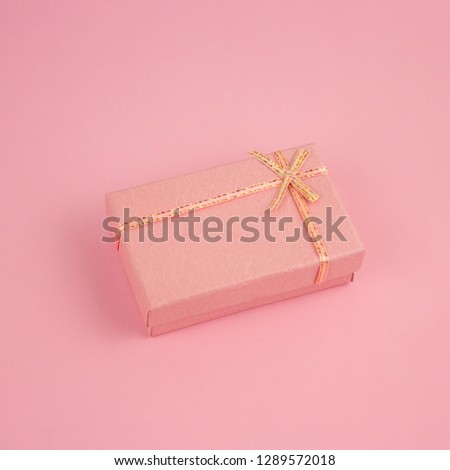 top view pink present box on a pink background