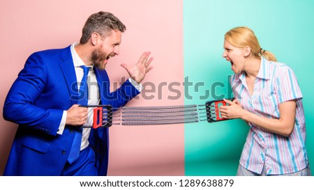 Gender equality and discrimination. Gender rivalry concept. Man and woman stretching expander opposite sides. Business rivalry guy and girl. Gender confrontation at workplace. Gender equal rights.