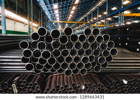 high quality Galvanized steel pipe or Aluminum and chrome stainless pipes in stack waiting for shipment  in warehouse Royalty-Free Stock Photo #1289663431