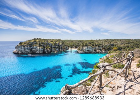Beautiful bay with sandy beach and sailing boats, Menorca island, Spain