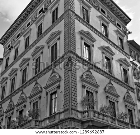 Italian architecture. Nice apartment building in the old town. Urban landscape. Upward look. Black and White Photography. Italy, Tuscany, Florence.
