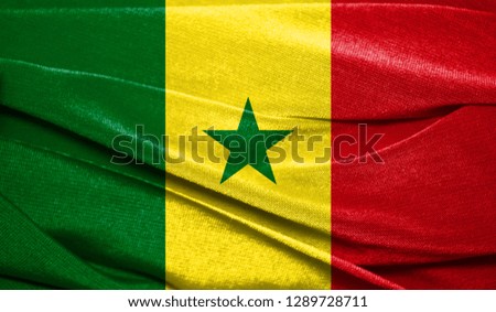 Realistic flag of Senegal on the wavy surface of fabric. Perfect for background or texture purposes