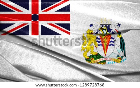 Realistic flag of British Antarctic Territory on the wavy surface of fabric. Perfect for background or texture purposes