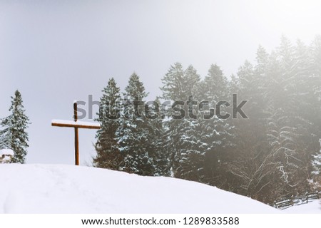 Picture of the cross on the hill  in winter season