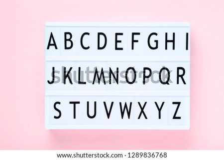 Lightbox with letters on pink background