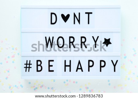 Lightbox with words Dont Worry Be Happy on white background
