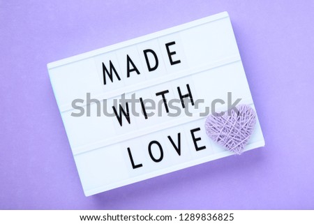 Lightbox with words Made With Love on purple background
