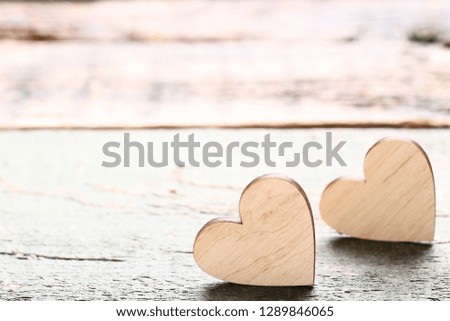 Brown hearts on grey wooden table
