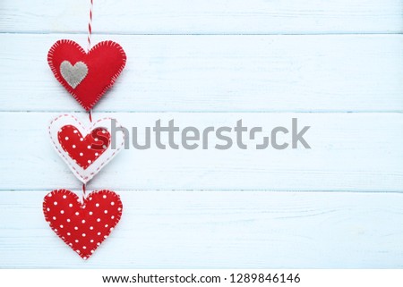 Fabric hearts on wooden table