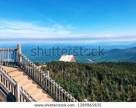 Cannon Mountain is a peak in the White Mountains of New Hampshire United States.The views of mountain ridge and blue sky from observation platform in summer.