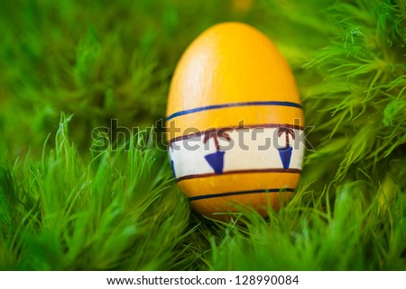 Close up of easter egg on green background