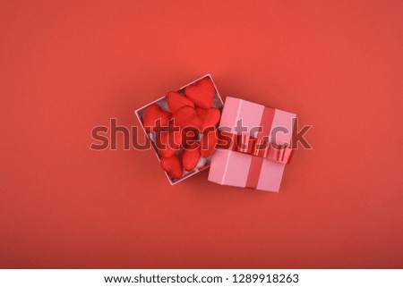 Gift box with red heart inside on red background. Valentine's day, mother's day, holiday, new year
