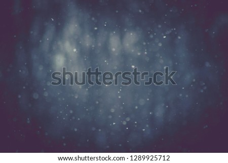 falling snow background, blurred vignetting abstract background