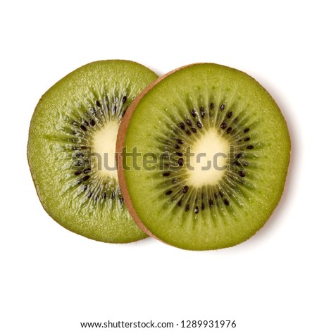 Two kiwi fruit slices isolated on white background closeup. Kiwifruit slices flatlay. Flat lay, top view.