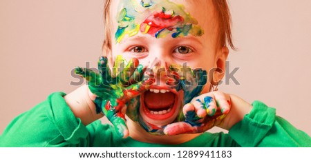 Happy childhood. Children's make up. Humorous picture. Art, color, creativity concept.