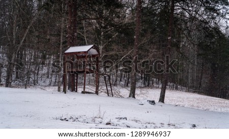 A tree house in the snow 