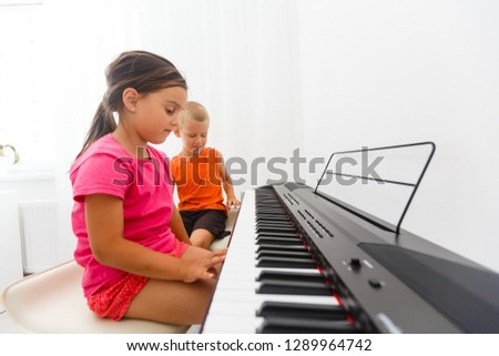 children playing the piano