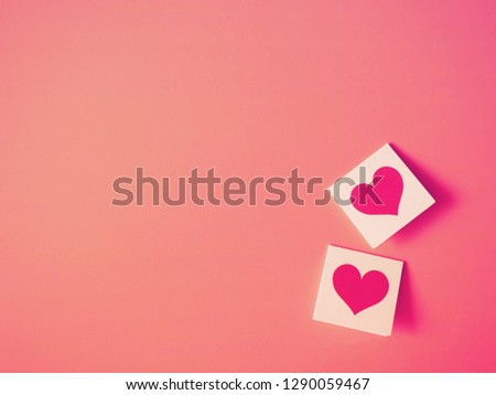 Top view of valentine card with red heart over pink background, copy space.