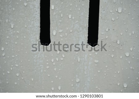 Rain droplets on metal fence