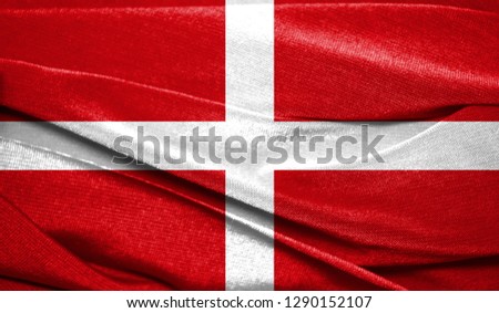 Realistic flag of Sovereign Military Order of Malta on the wavy surface of fabric. Perfect for background or texture purposes