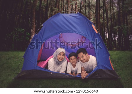 Picture of Muslim family enjoying their holiday while camping in the forest