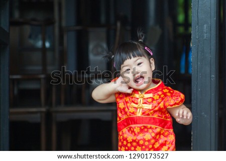 Happy Chinese new year concept . smiling little girls Traditional Chinese dress.