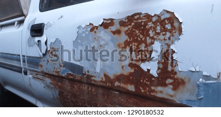 Deterioration of car paint that causes corrosion and Rust on the body of the car Take pictures with a mobile camera, natural light