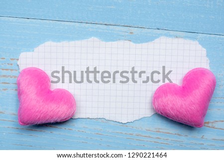 blank paper note with couple pink heart shape decoration on blue wooden table background. Wedding, Romantic and Happy Valentine’ s day holiday concept