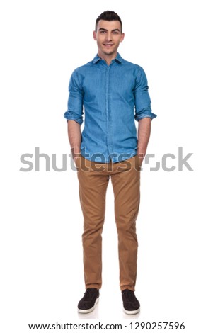 relaxed casual man standing with hands in pockets on white background, full body picture