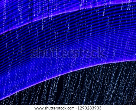 Blue lights in motion at night as an abstract background.