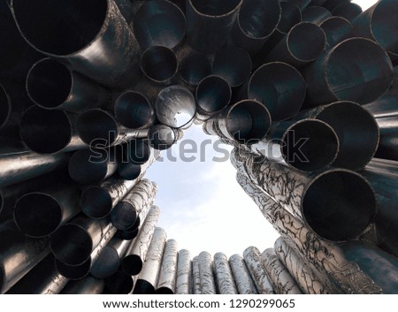 
Iron pipes bottom view against the blue sky