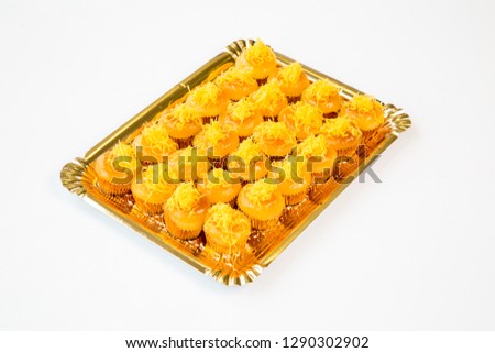 egg cupcakes in a gold tray on white background