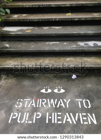 Stairway to pulp heaven that has been write at the floor. Concrete background.