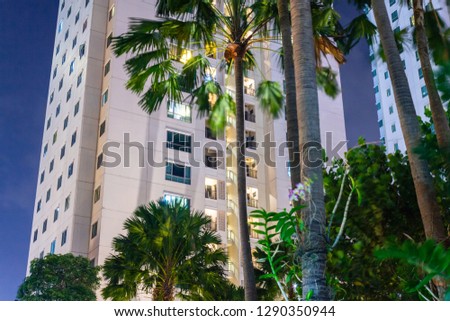Tropical condo apartment windows at night.  Modern luxury highrise real estate and privacy for each unit.