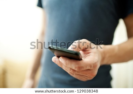 Close up of a man using mobile smart phone Royalty-Free Stock Photo #129038348