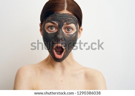 surprised woman in cosmetic mask