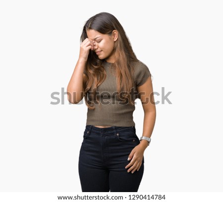 Young beautiful brunette woman over isolated background tired rubbing nose and eyes feeling fatigue and headache. Stress and frustration concept.