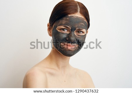 woman in a cosmetic mask of natural substances