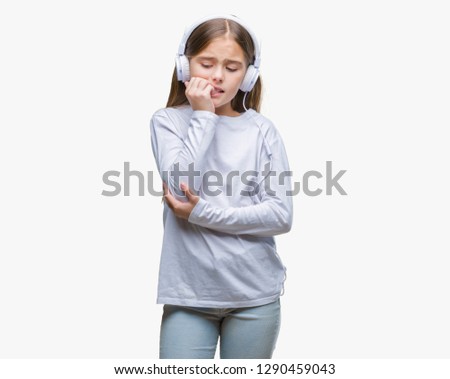 Young beautiful girl wearing headphones listening to music over isolated background looking stressed and nervous with hands on mouth biting nails. Anxiety problem.