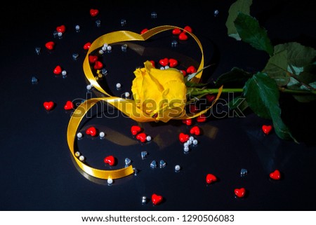   Romantic postcard blank rose and heart from ribbon for Valentine's Day on black background                             