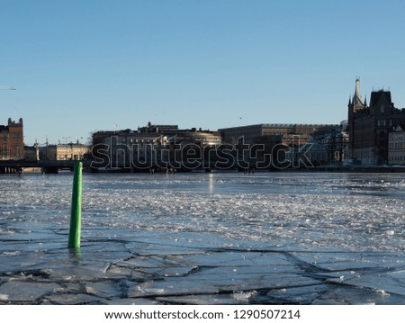 Ice Skaters, Bridges and frozen lakes at the waterfront in Stockholm a Sunny Winter Day