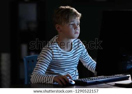 Cute little boy after losing computer game at home
