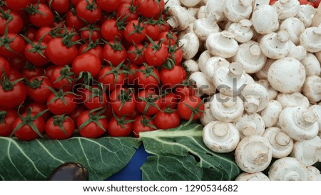 red tomatoes lined up for sale in the market