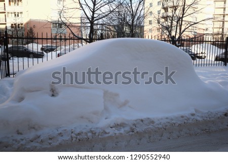 the forgotten car is completely in the snow