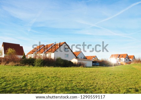 new build middle class family houses on the green in Germany Royalty-Free Stock Photo #1290559117