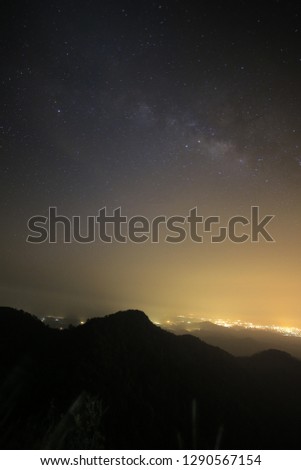 The magic galaxy or milky way on the night sky with mountain peek foreground