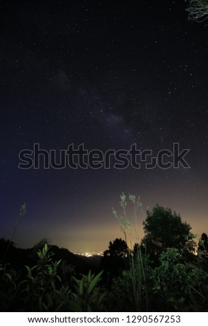 The magic galaxy or milky way on the night sky with mountain peek foreground