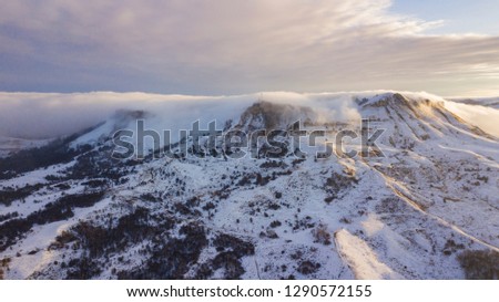 Aerial view of clouds above mountains. Picturesque and gorgeous scene.