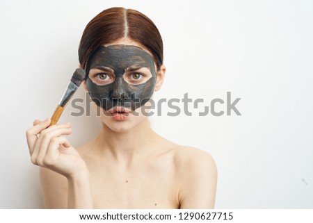 young woman with clay mask skin care spa care healthy